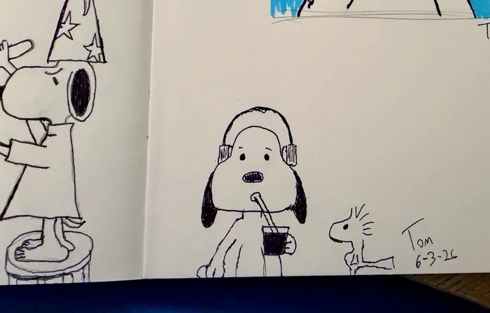 Snoopy wearing headphones and holding a drink beside Woodstock.