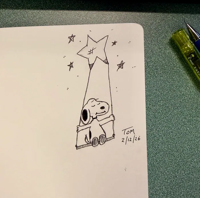 Snoopy sitting on a swing beneath a star.
