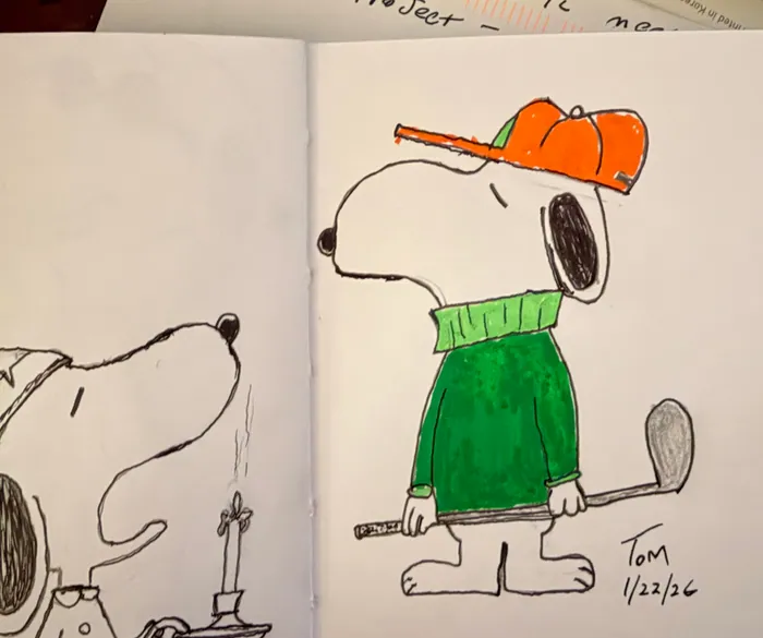 Snoopy in a green sweater, orange cap, and holding a golf club.