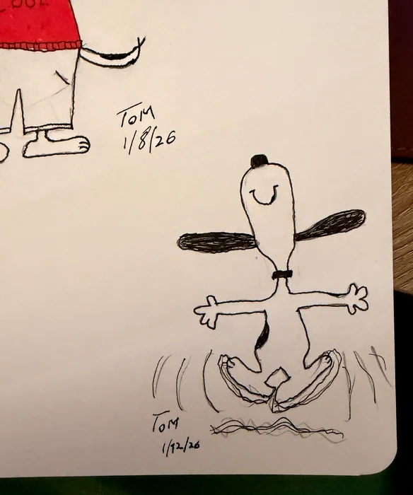 Snoopy with outstretched arms above a small boat.
