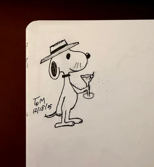 Snoopy in a brimmed hat holding a small glass.