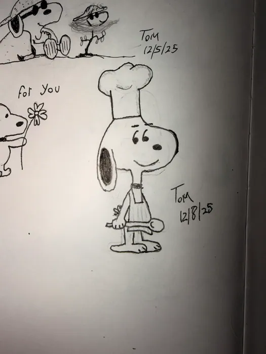 Snoopy in a chef hat holding a spoon.